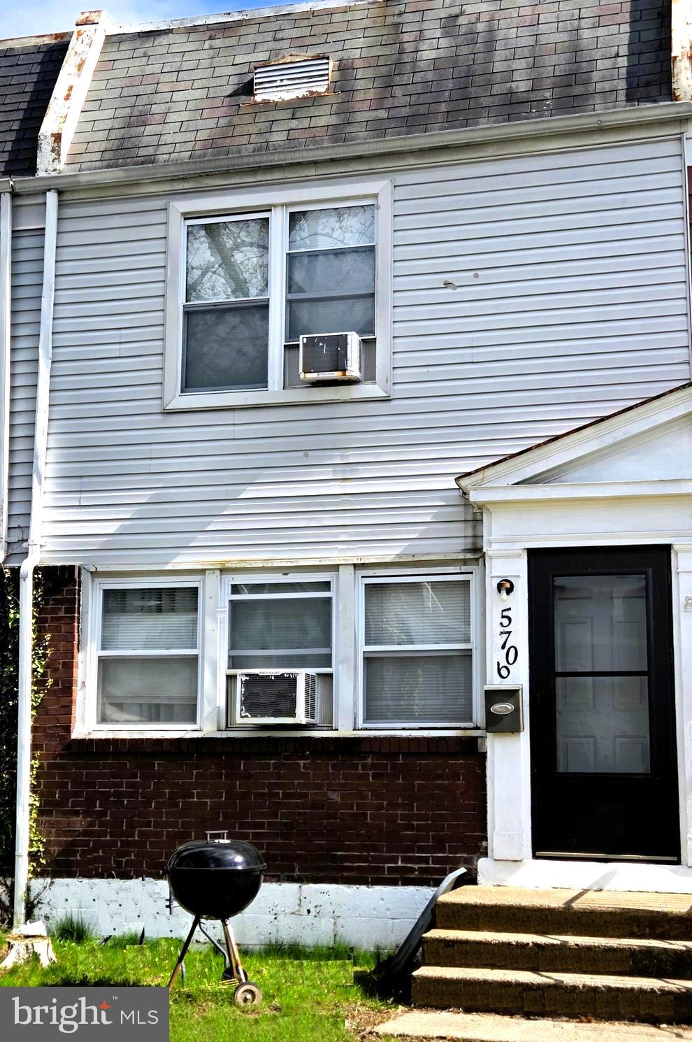 5706 Mitchell Road Levittown, PA 19057 - Photo 1 of 7 a front view of a house with a yard