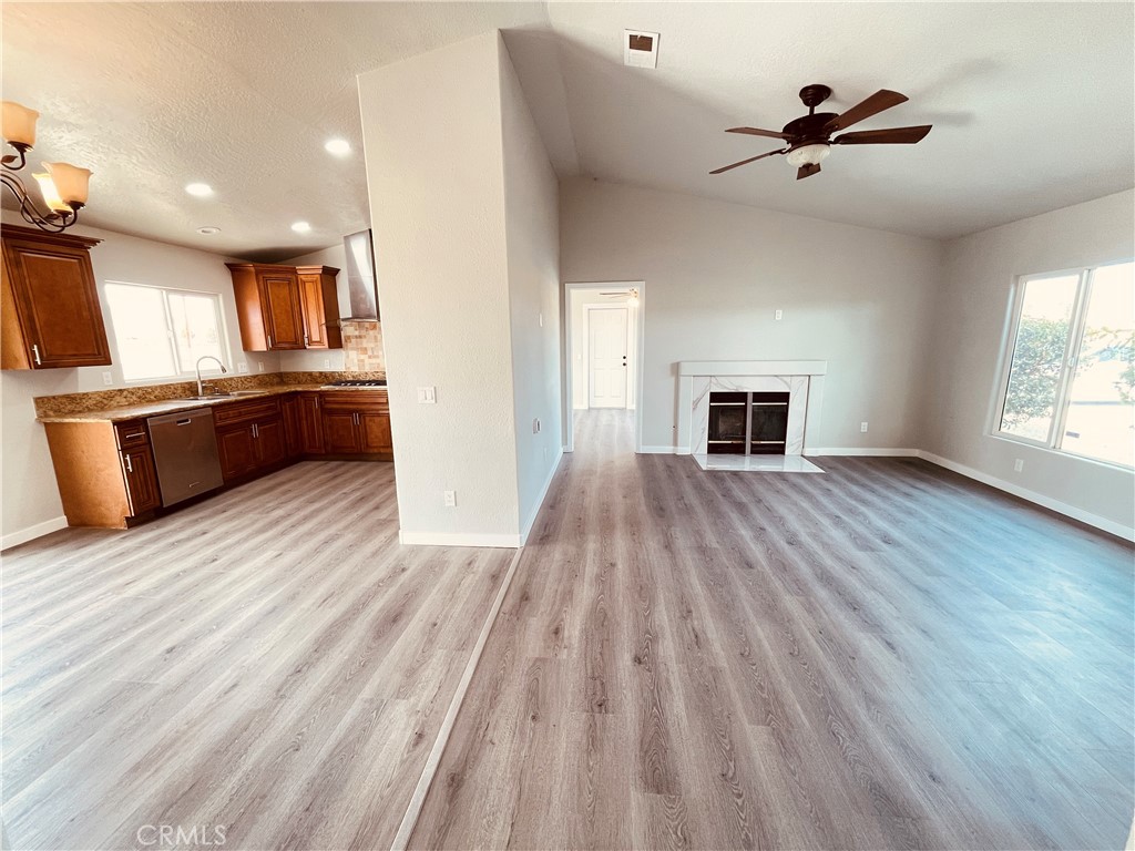 20891 Thunderbird Road Apple Valley, CA 92307 - Photo 14 of 45 a view of kitchen and microwave in a room