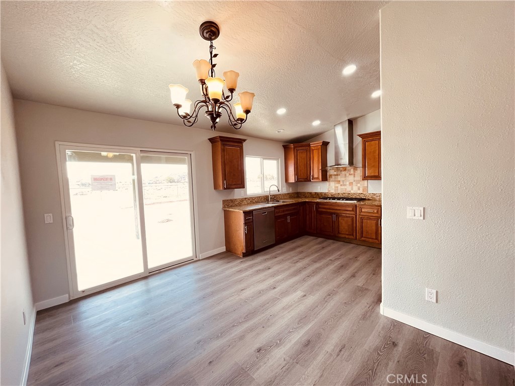 20891 Thunderbird Road Apple Valley, CA 92307 - Photo 16 of 45 a view of a kitchen with a sink and cabinets