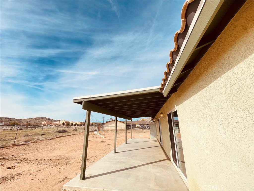 20891 Thunderbird Road Apple Valley, CA 92307 - Photo 38 of 45 a view of balcony with furniture and wooden floor