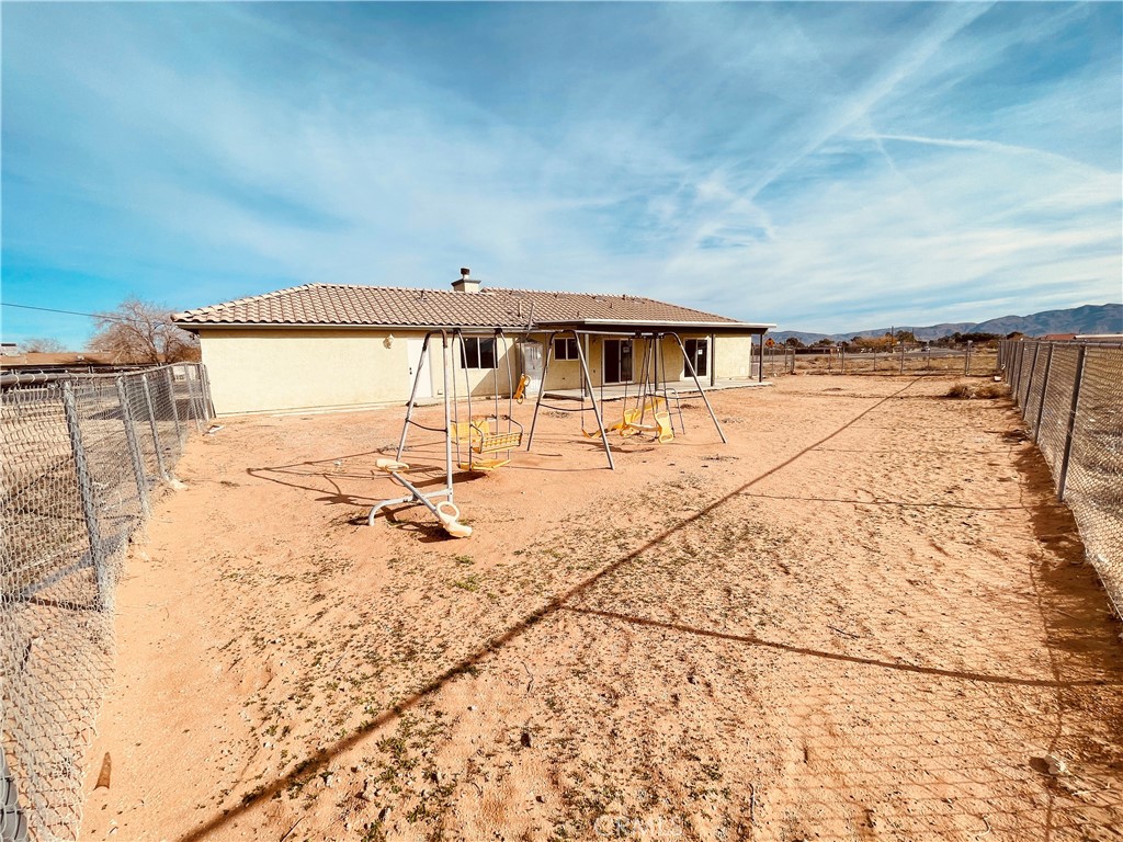20891 Thunderbird Road Apple Valley, CA 92307 - Photo 40 of 45 a view of a terrace with wooden floor