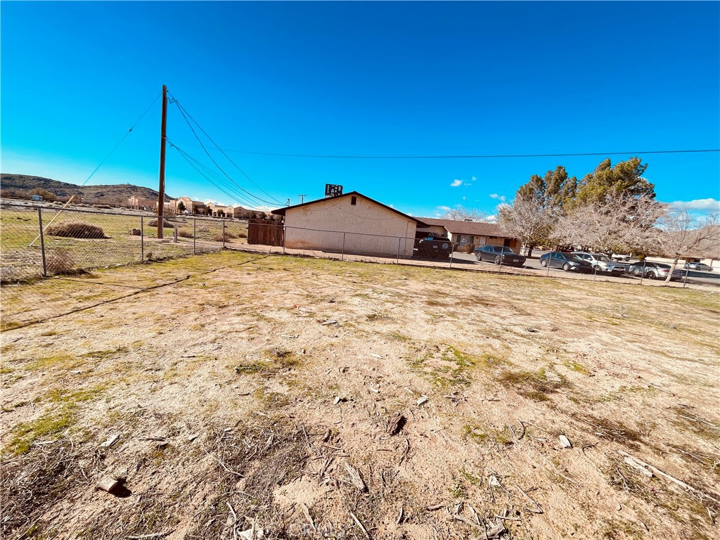 20891 Thunderbird Road Apple Valley, CA 92307 - Photo 41 of 45 a large pool with a house in the background