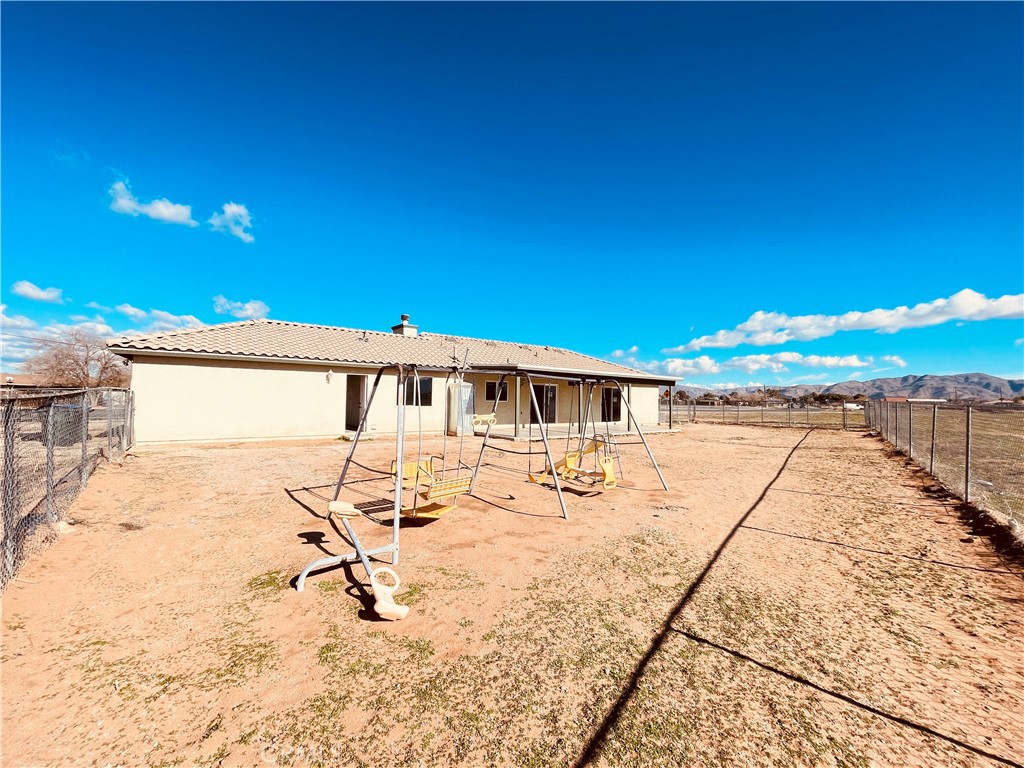 20891 Thunderbird Road Apple Valley, CA 92307 - Photo 42 of 45 a view of a house with a patio