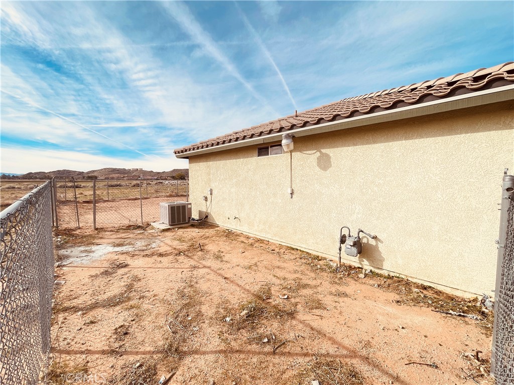 20891 Thunderbird Road Apple Valley, CA 92307 - Photo 7 of 45 a view of a backyard of the house