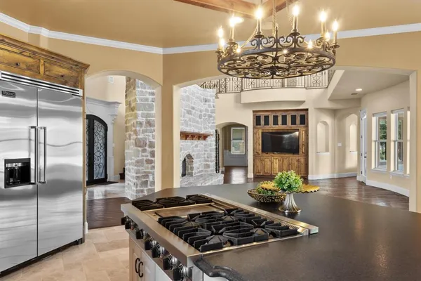 a kitchen with a sink and stove