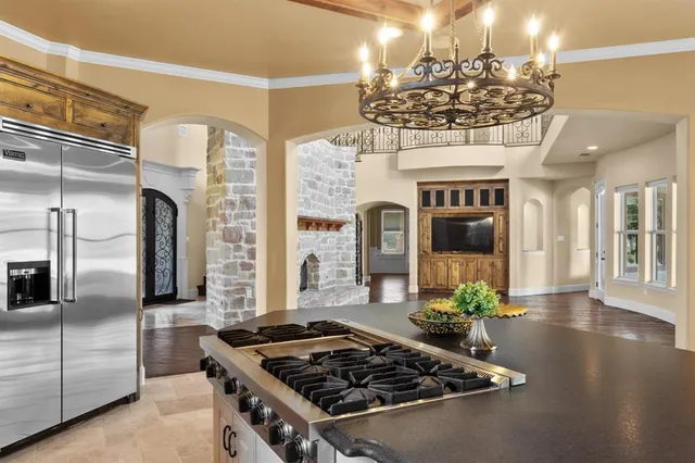 a kitchen with a sink and stove