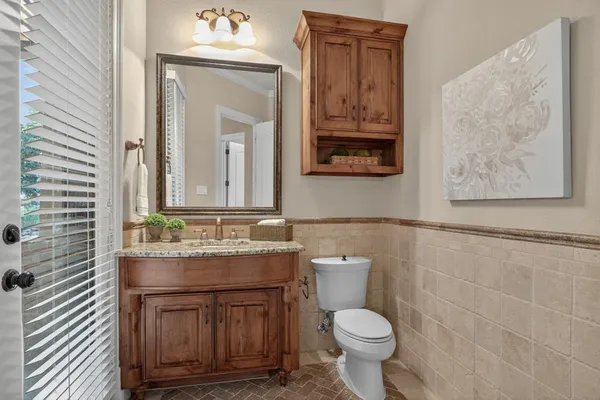 a kitchen with a stove and refrigerator