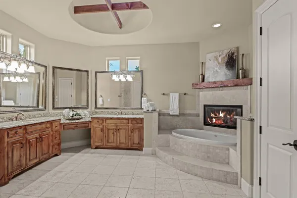 a bedroom with a bed and a fireplace