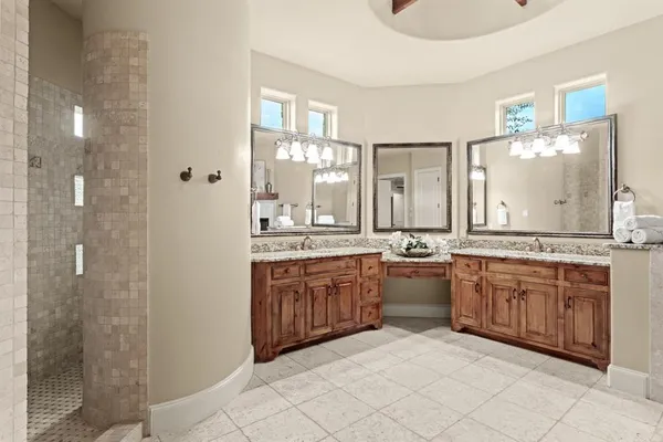 a large kitchen with a fireplace and a sink