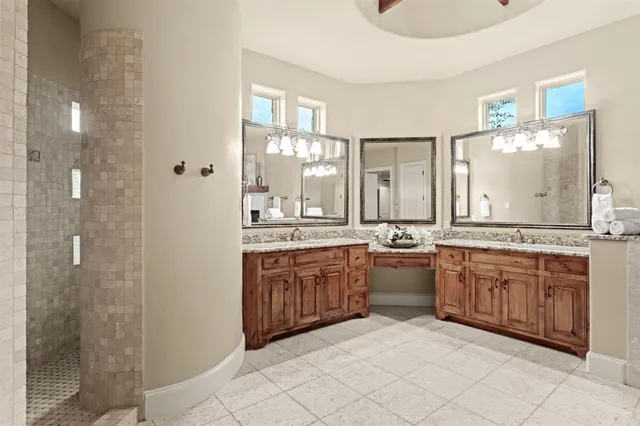 a large kitchen with a fireplace and a sink