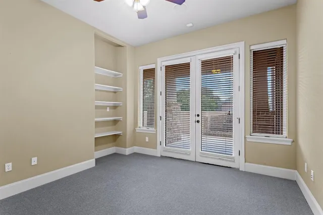 a bathroom with a granite countertop sink a toilet and a mirror