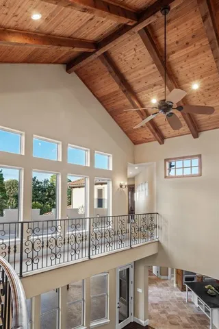 a view of room with balcony and entryway