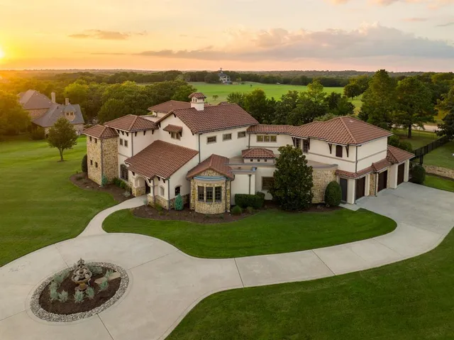 an aerial view of residential houses with outdoor space and street view