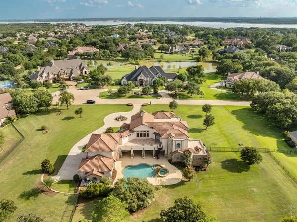 a front view of a house with a yard table and chairs