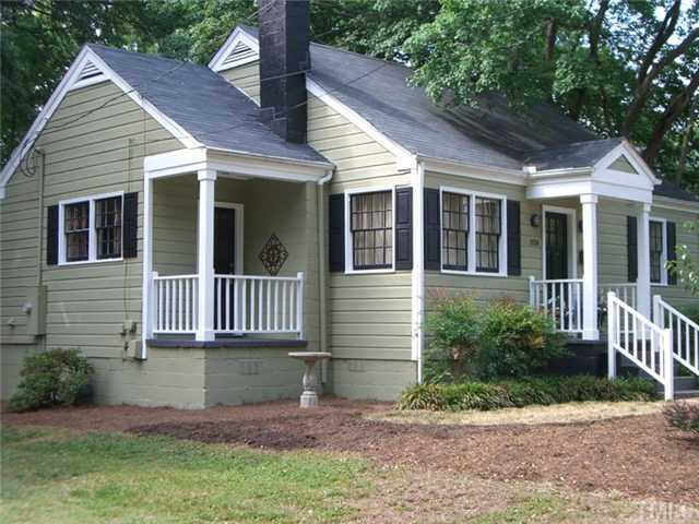 506 Burton Street Raleigh, NC 27608 - Photo 1 of 6 a view of a house with a yard
