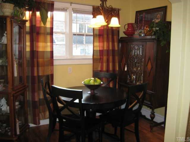506 Burton Street Raleigh, NC 27608 - Photo 4 of 6 a view of a dining room with furniture and chandelier
