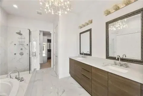a bathroom with a shower and vanity