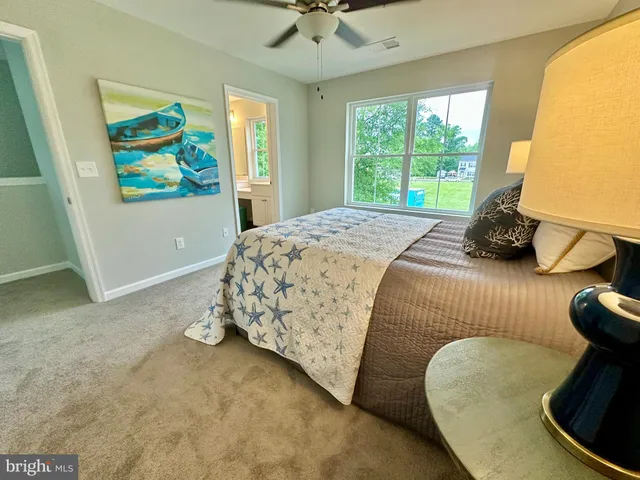a room with a sink cabinets and wooden floor