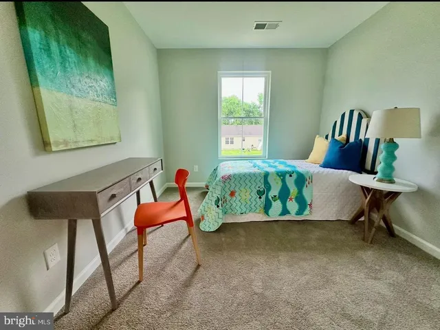 a picture of a bathroom with a window