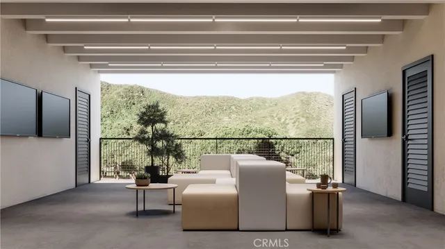 a living room with furniture and a kitchen