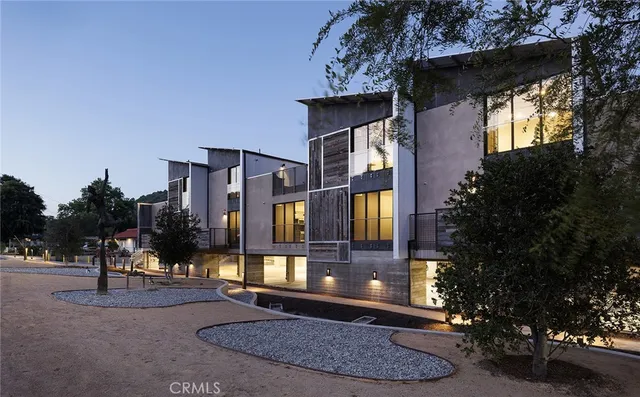 a view of a building with a yard