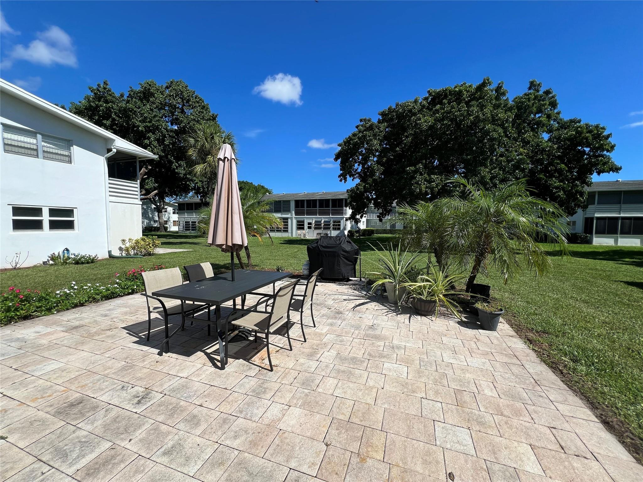 246 Markham L, Unit 246 Deerfield Beach, FL 33442 - Photo 9 of 27 OUTDOOR BUILDING PATIO