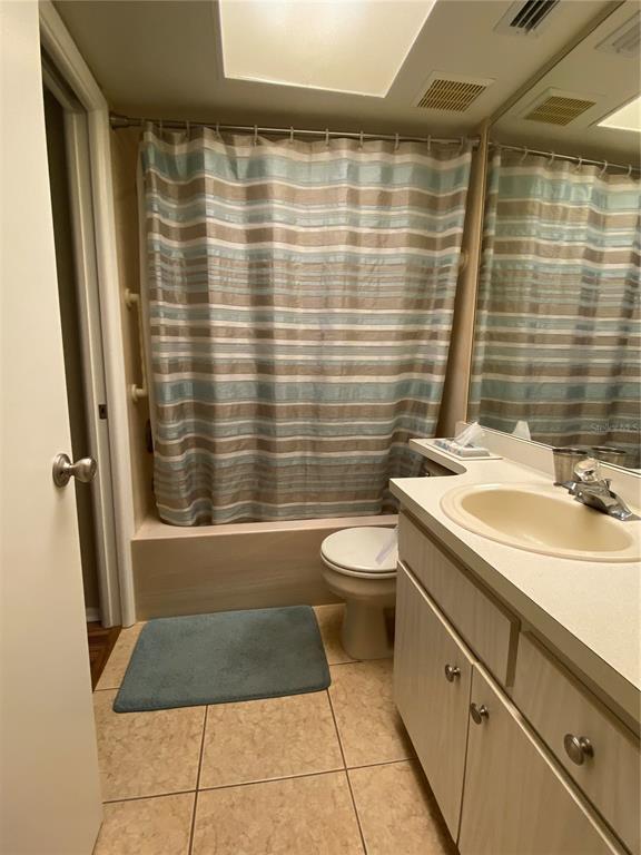 9609 Midiron Court, Unit 1 New Port Richey, FL 34655 - Photo 13 of 16 a bathroom with a sink toilet and shower