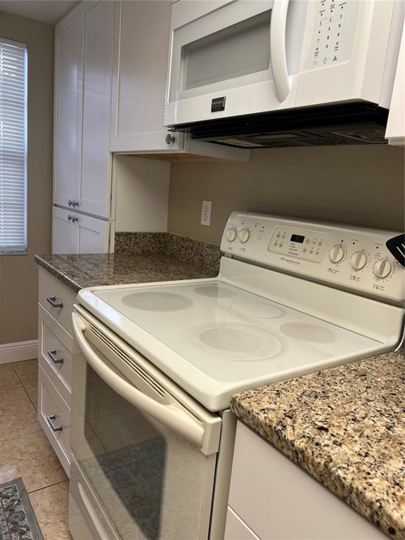 9609 Midiron Court, Unit 1 New Port Richey, FL 34655 - Photo 8 of 16 a utility room with dryer and washer