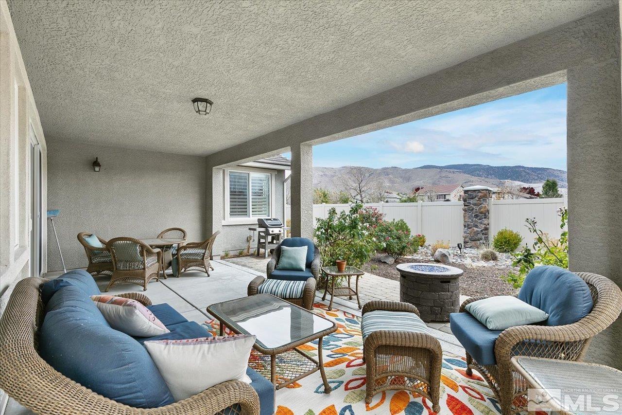 2280 Trakehner Lane Reno, NV 89521 - Photo 17 of 24 a living room with furniture and a large window