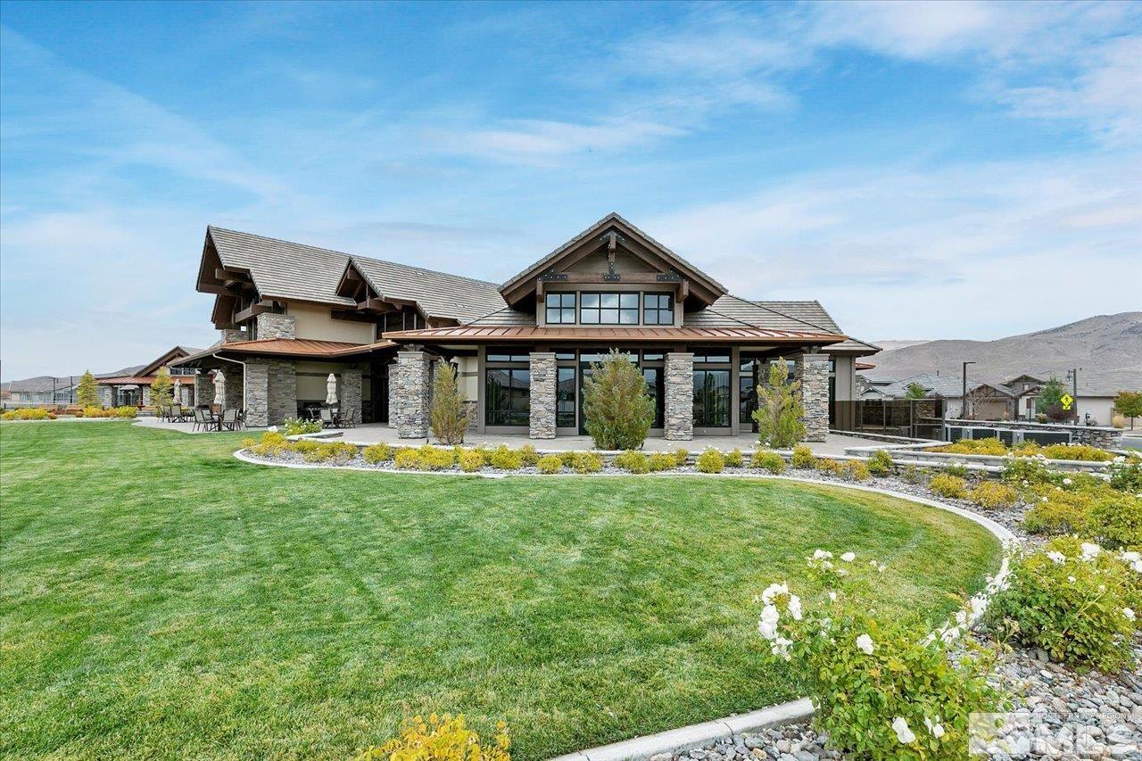 2280 Trakehner Lane Reno, NV 89521 - Photo 20 of 24 a front view of a house with swimming pool having outdoor seating