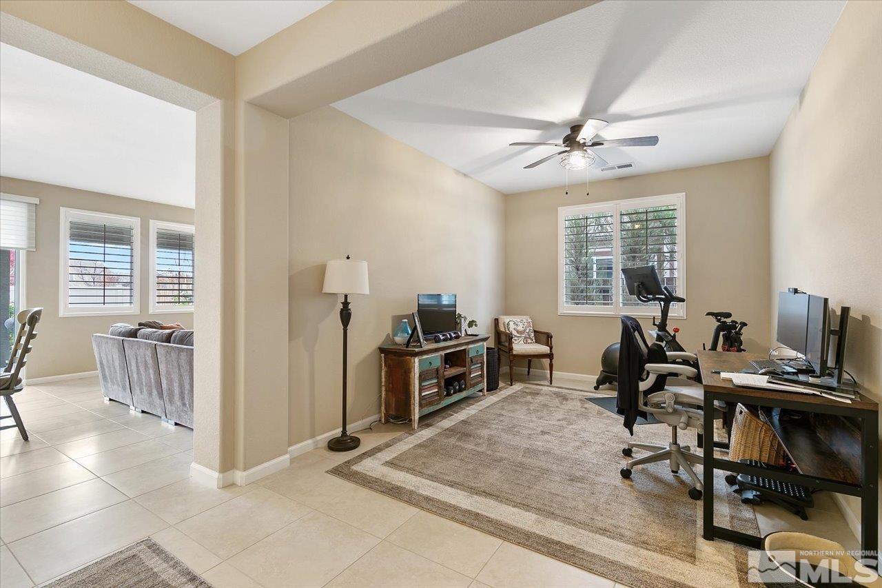 2280 Trakehner Lane Reno, NV 89521 - Photo 6 of 24 a view of a workspace with furniture and a window