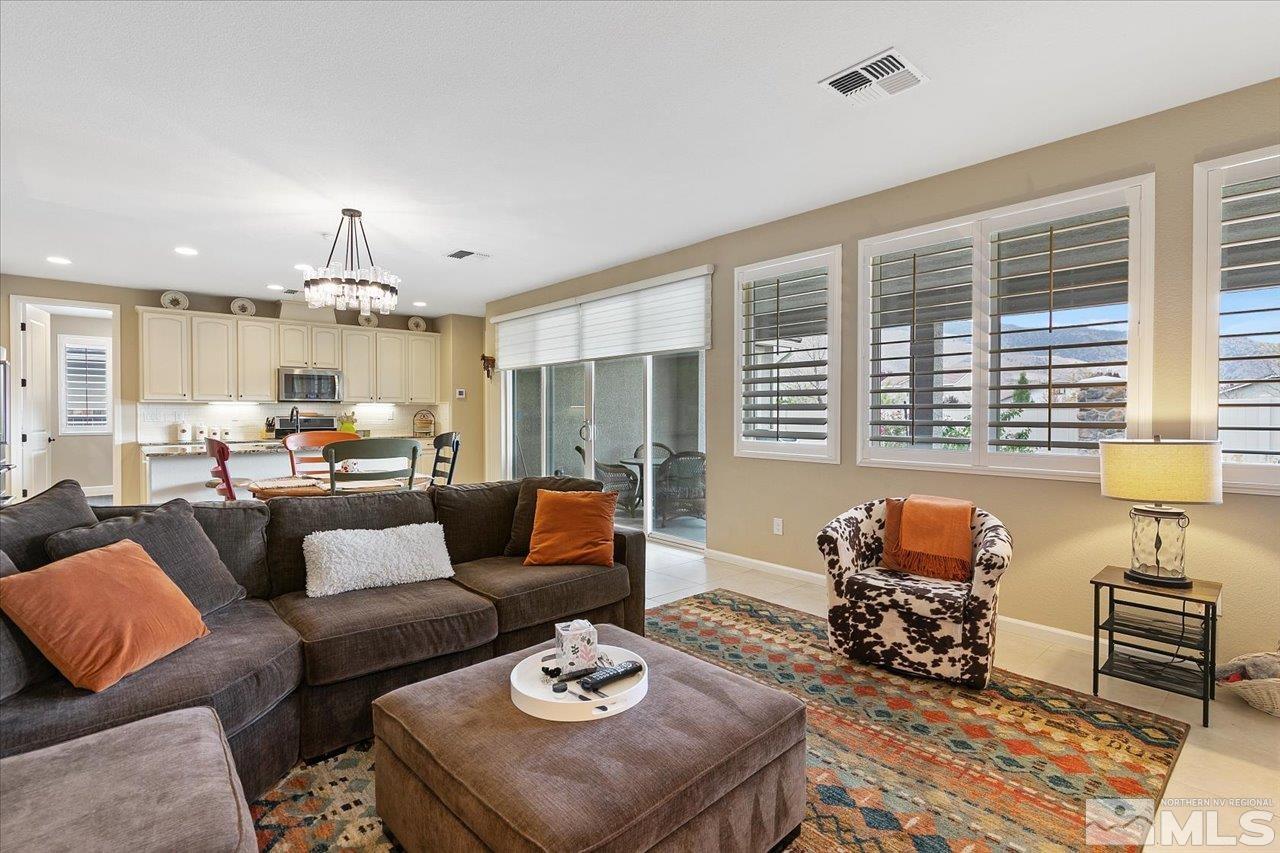 2280 Trakehner Lane Reno, NV 89521 - Photo 10 of 24 a living room with furniture and a large window