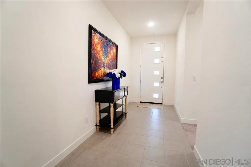8831 Weston Road Santee, CA 92071 - Photo 3 of 25 wooden floor in a hall with a window