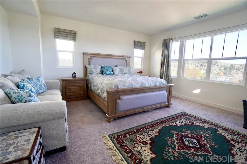 8831 Weston Road Santee, CA 92071 - Photo 10 of 25 a bedroom with a bed and a couch
