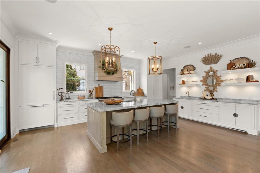 4240 Paces Ferry Road Southeast Atlanta, GA 30339 - Photo 19 of 66 a kitchen with white cabinets and stove