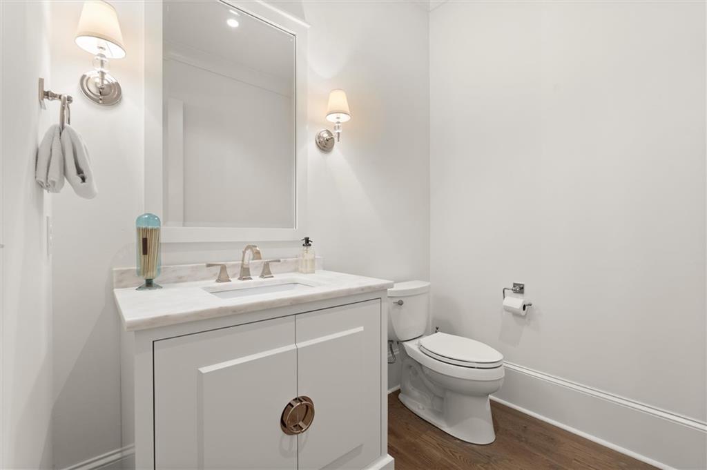 4240 Paces Ferry Road Southeast Atlanta, GA 30339 - Photo 27 of 66 a bathroom with a sink a toilet and mirror