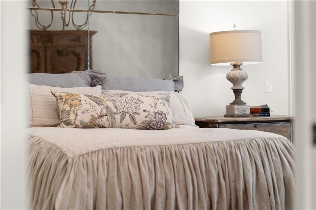 4240 Paces Ferry Road Southeast Atlanta, GA 30339 - Photo 28 of 66 a bedroom with a bed and a mirror