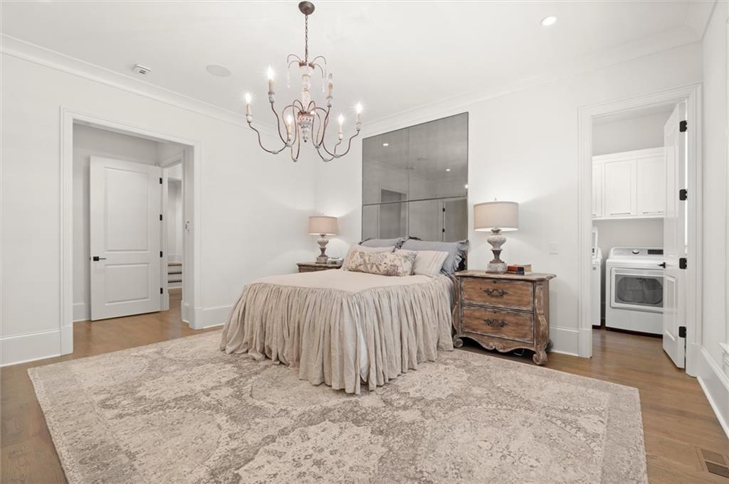 4240 Paces Ferry Road Southeast Atlanta, GA 30339 - Photo 30 of 66 a spacious bedroom with a bed and dresser
