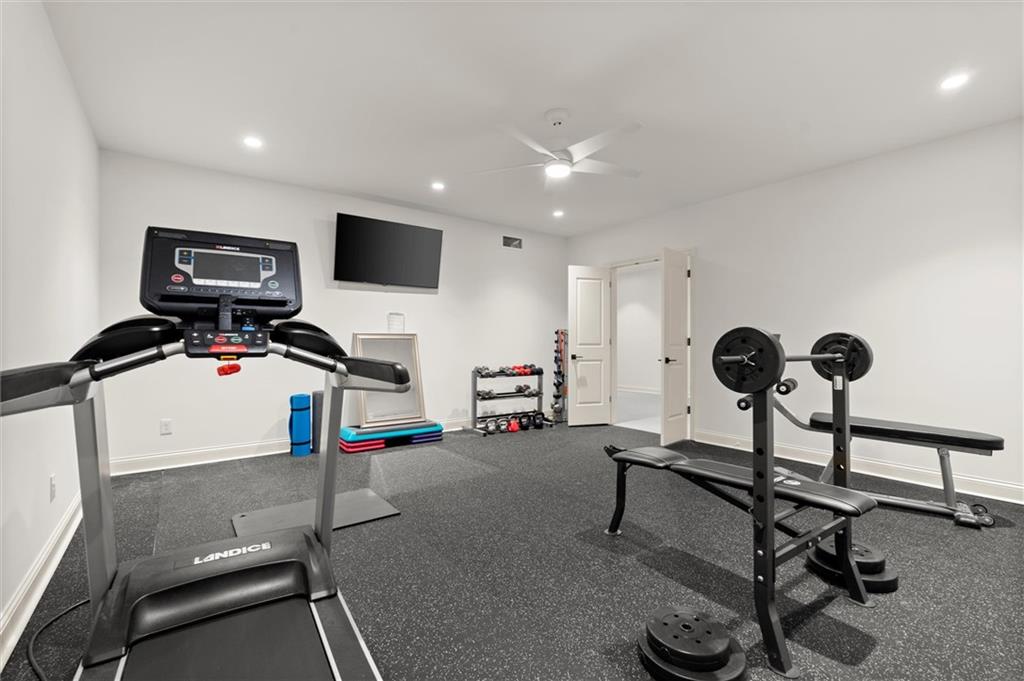4240 Paces Ferry Road Southeast Atlanta, GA 30339 - Photo 42 of 66 a view of a livingroom with gym equipment