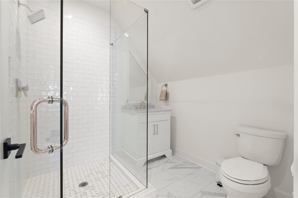 4240 Paces Ferry Road Southeast Atlanta, GA 30339 - Photo 50 of 66 a bathroom with a toilet and a shower