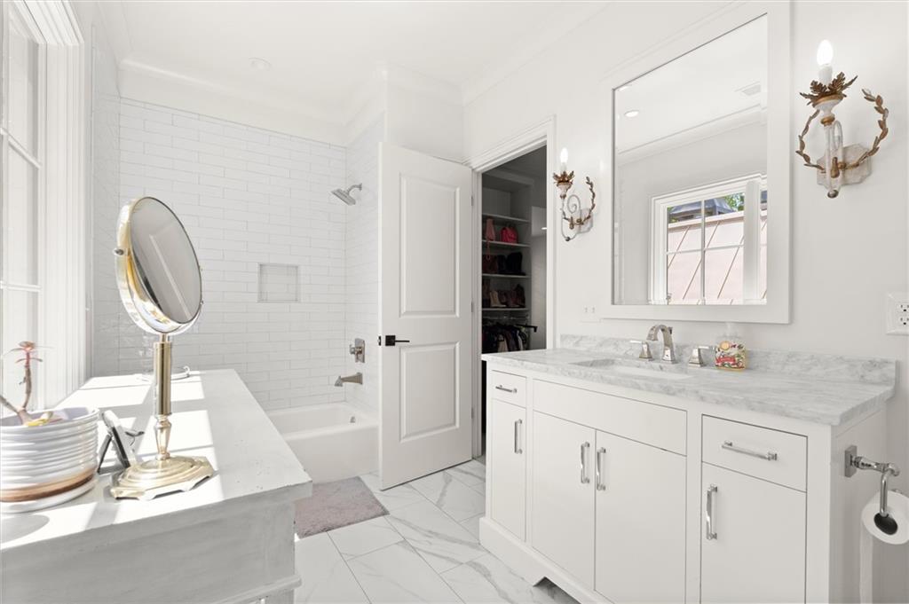 4240 Paces Ferry Road Southeast Atlanta, GA 30339 - Photo 54 of 66 a spacious bathroom with a sink double vanity and a mirror