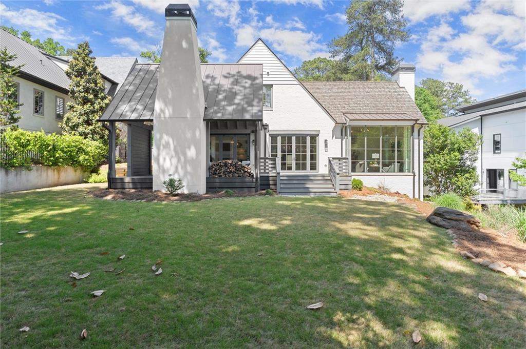 4240 Paces Ferry Road Southeast Atlanta, GA 30339 - Photo 60 of 66 a front view of a house with a yard