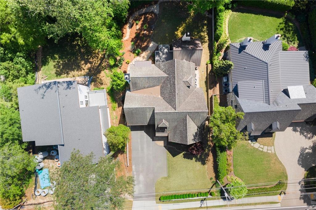 4240 Paces Ferry Road Southeast Atlanta, GA 30339 - Photo 62 of 66 an aerial view of a house with yard and seating space