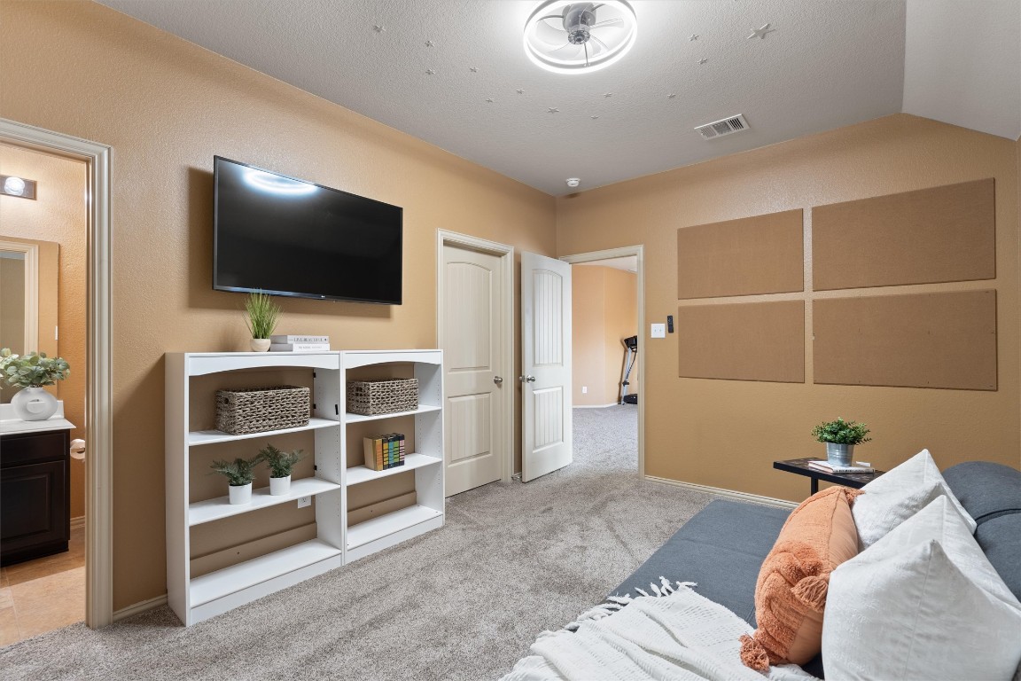 1425 Naranjo Drive Georgetown, TX 78628 - Photo 21 of 38 a bedroom with a bed and a flat screen tv