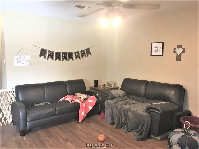 a living room with furniture and a couch