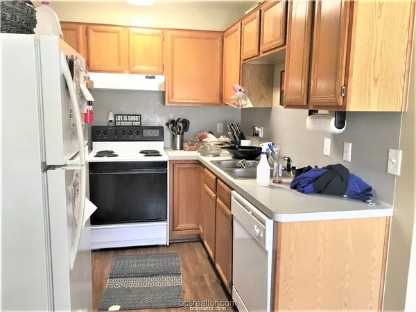 a kitchen with stainless steel appliances a stove a microwave and a refrigerator
