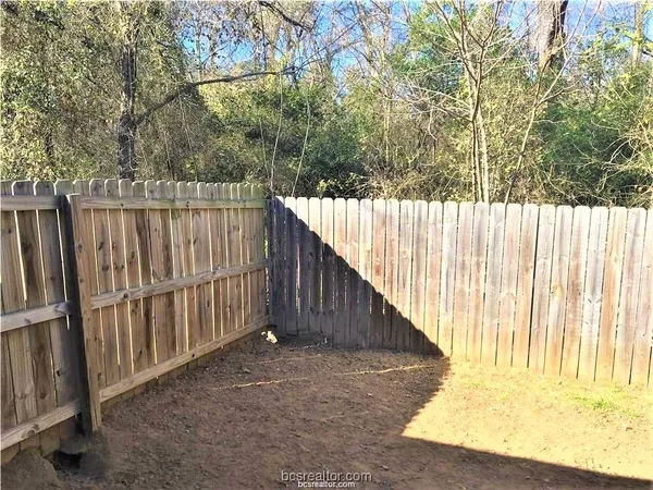 a view of a balcony with wooden fence