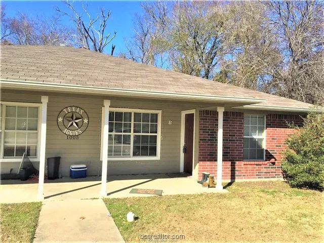 a house with trees in the background