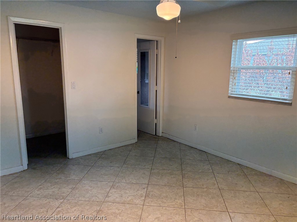 3913 Ferrari Drive Sebring, FL 33872 - Photo 10 of 20 an empty room that has a window in it
