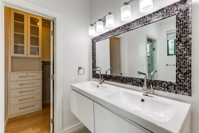 a bathroom with a sink and a mirror